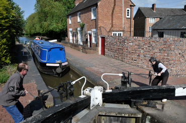 A Canal Boat Approaching A Lock